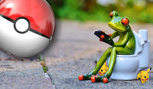 red-eyed tree frog on toilet using smartphone figurine on gray concrete floor thumbnail