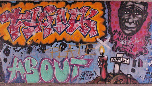 concrete wall with painted with with assorted artwork thumbnail