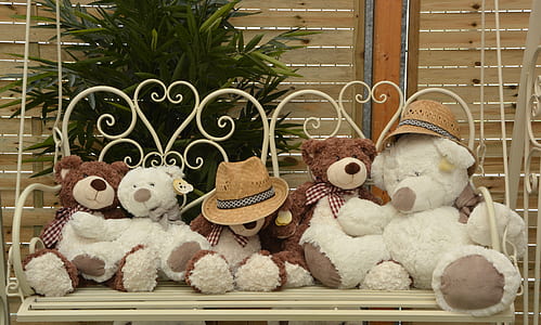 bear plush toys on brown porch swing thumbnail