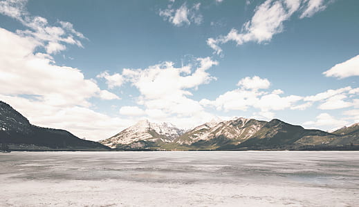 White Brown Mountain Under White Cloud and Blue Sky during Daytime thumbnail
