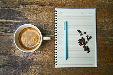 white ceramic mug and blue pen thumbnail