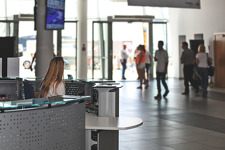woman sitting on front of counter desk thumbnail