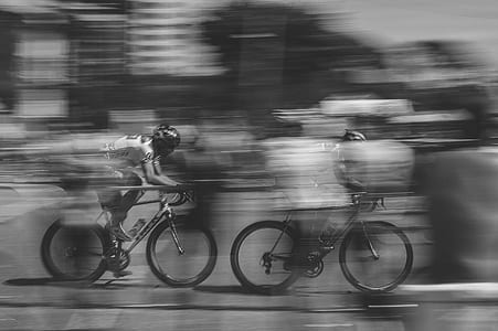 two person racing a bicycle grayscale photo thumbnail