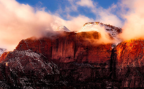 red mountain under cloudy sky thumbnail