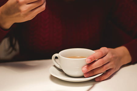 Person Holding White Ceramic Cup thumbnail