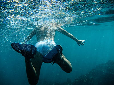 woman wearing white bikini in body of water thumbnail