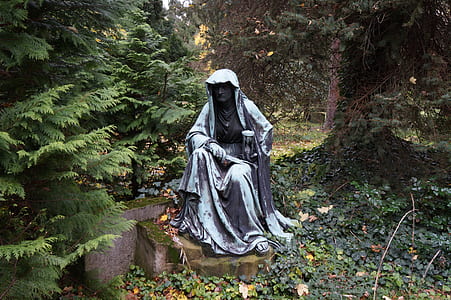 woman sitting on rock statue thumbnail