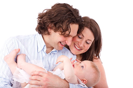 woman beside man holding baby thumbnail