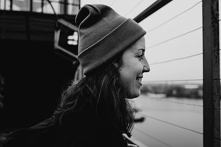 grayscale photograph of woman wearing beanie cap thumbnail