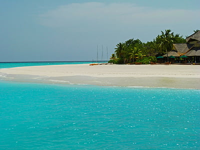 landscape photo of black house near seashore thumbnail