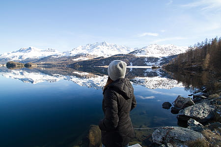 Woman Wearing Black Hooded Jacket Watching Mountain thumbnail