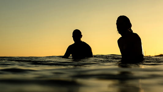 Silhouette of Two Person in Water thumbnail