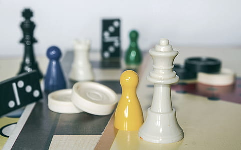 white chess piece on brown surfacew thumbnail