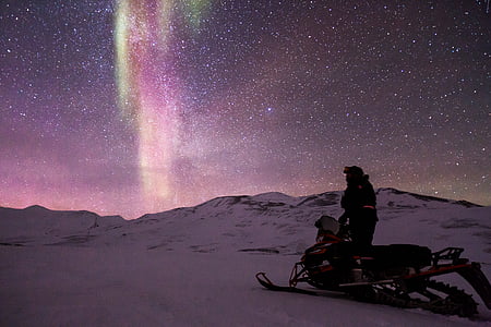 person riding on snowmobile thumbnail