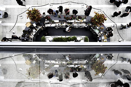 asymmetrical photo of group of people inside commercial building thumbnail
