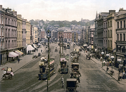 Patrick Street around 1900 with cars and people in Cork, Ireland thumbnail