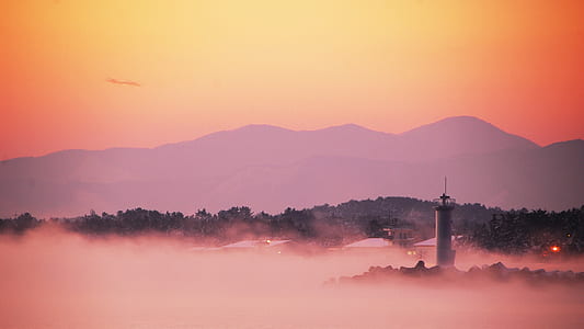 watch tower surrounded by fog thumbnail