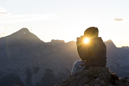toddler on cliff holding camera thumbnail