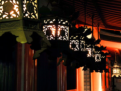 lighted black lantern lamps hanging near brown wall thumbnail
