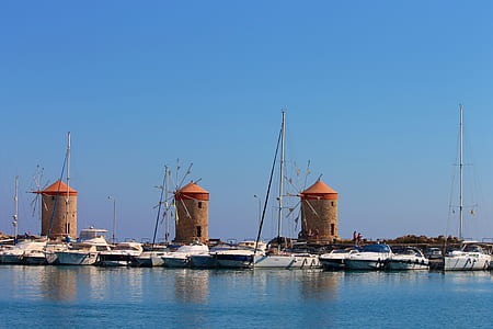 boats docked on body of water thumbnail