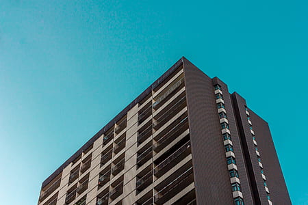 low-angle photo of brown concrete builing thumbnail