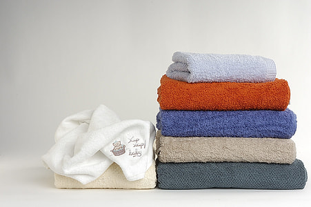 pile of assorted towels on top of white surface thumbnail