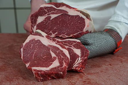 person holding raw meat thumbnail
