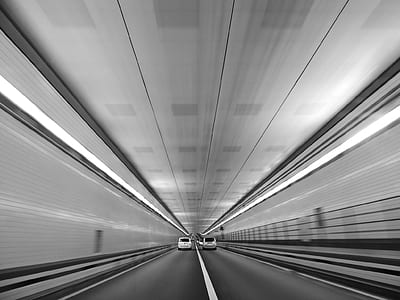 two cars driving in tunnel thumbnail