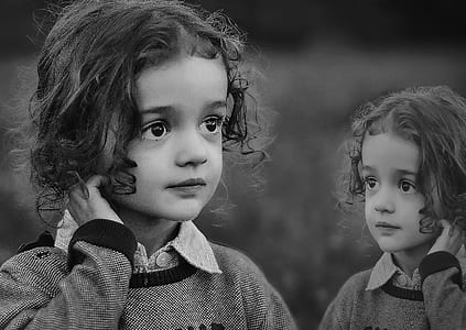 grayscale photo of girl with sweater thumbnail