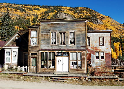 brown 2-storey house near mountain thumbnail