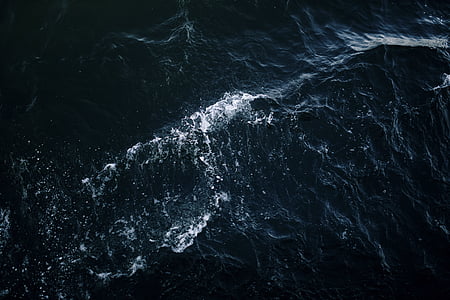 rippling sea taken during daytime thumbnail