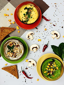 slices of mushroom and red chili with triangular slice of loaf bread thumbnail