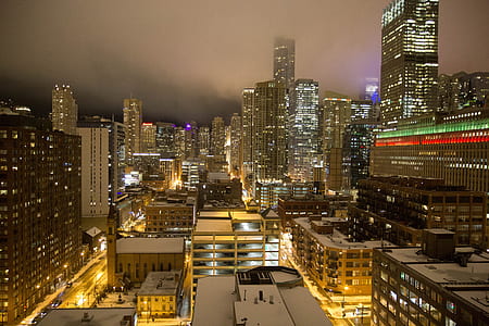 lighted city buildings during nighttime thumbnail