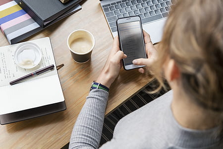 woman sitting beside table with coffee on top thumbnail