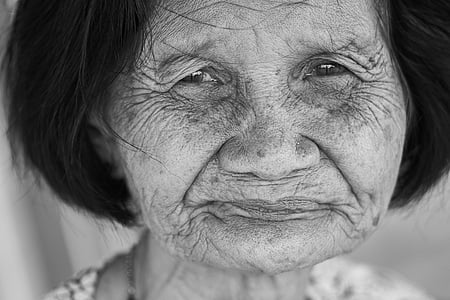 grayscale photo of woman smiling thumbnail
