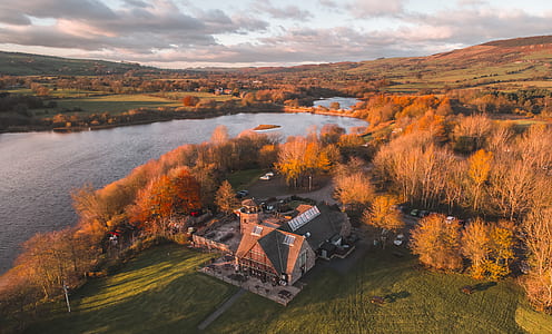 aerial view of house near lake thumbnail