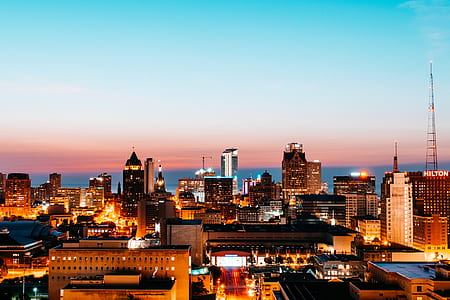 aerial view of city buildings during sunset thumbnail