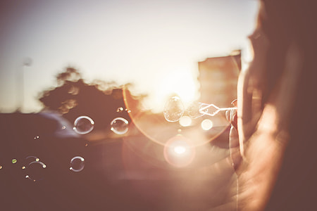 Girl Blowing Bubbles in the Sunset Evening thumbnail