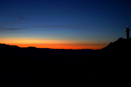 silhouette photo of mountain during sunset thumbnail