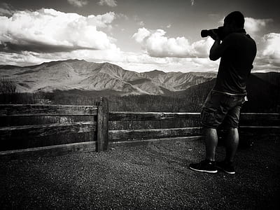 grayscale photography of person taking photo thumbnail