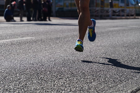 person wearing purple running shoes thumbnail