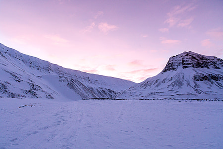 snow covered mountains during daytime thumbnail