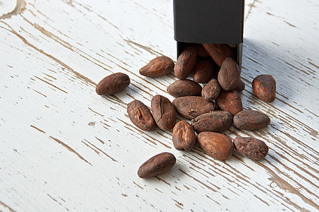brown nuts placed on white wood surface thumbnail