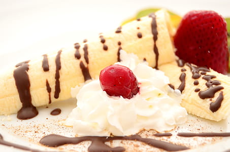 banana split with whip cream and cherry thumbnail