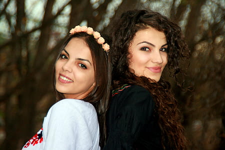 two women wearing gray and black tops thumbnail