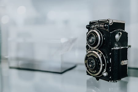 Old camera on glass shelf thumbnail