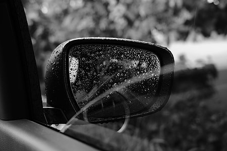 grayscale photo of unpaired car side mirror thumbnail