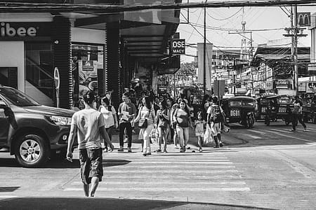 Monochrome Photography of People Crossing The Road thumbnail