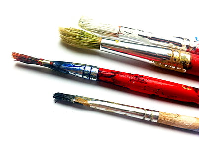 four assorted color paint brushes on white surface thumbnail