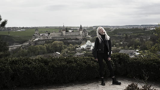 woman standing on cliff thumbnail